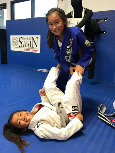 Kids drilling jiu jitsu technique